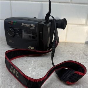 Vintage JVC AX710U Compact VHS Camcorder with strap. Untested.